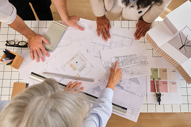 The Decorate Home Space design team reviewing renovation plans